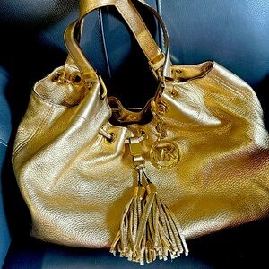 Gold leather, Michael Kors handbag.